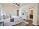 Comfortable bedroom with hardwood floors, dresser, and a view into the ensuite bathroom at 590 Grand Central Sta, Apex, NC 27502
