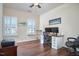 Comfortable home office with hardwood floors, natural light, and ceiling fan at 590 Grand Central Sta, Apex, NC 27502