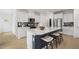 New kitchen boasts stainless appliances, quartz countertops, and eat-in island with seating at 6002 Enclosure Way, Durham, NC 27703