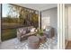 Relaxing screened porch offers comfortable outdoor seating and views of nature at 6002 Enclosure Way, Durham, NC 27703