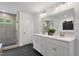 Elegant bathroom featuring double vanity, large mirror, and glass shower at 6019 Enclosure Way, Durham, NC 27703