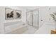 Luxurious bathroom with a soaking tub, walk-in shower, and elegant marble at 6019 Enclosure Way, Durham, NC 27703