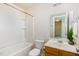Clean bathroom featuring a tub, toilet, and sink with a mirror at 627 Hastings Rd, Mebane, NC 27302