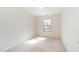 Cozy bedroom featuring neutral carpeting and a window for natural light at 627 Hastings Rd, Mebane, NC 27302