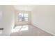 Bright bedroom with neutral carpet, a single window, and fresh, light walls at 627 Hastings Rd, Mebane, NC 27302