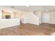 Spacious living area with hardwood floors, leading to the staircase and front door at 627 Hastings Rd, Mebane, NC 27302