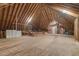 Spacious unfinished attic with exposed wooden beams, offering endless possibilities for customization and expansion at 6452 Therfield Dr, Raleigh, NC 27614