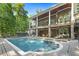 Stunning backyard featuring a pool, patio, and landscaped greenery, ideal for outdoor living and entertaining at 6452 Therfield Dr, Raleigh, NC 27614