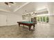 Basement game room with pool table, and access to outside at 6452 Therfield Dr, Raleigh, NC 27614