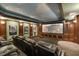 Home theater with tiered seating and large screen at 6452 Therfield Dr, Raleigh, NC 27614