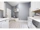 Well-organized mud room with built-in seating, storage shelves, and a utility sink for added convenience and functionality at 6452 Therfield Dr, Raleigh, NC 27614