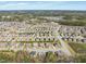 Aerial view showcases a community filled with homes, nature and meticulously manicured landscapes at 7652 Channery Way, Raleigh, NC 27616