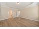 Large bedroom featuring wood floors and adjacent bathroom and closet at 7652 Channery Way, Raleigh, NC 27616