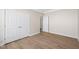 Bedroom showcasing closet, light, neutral colors, and wood floors at 7652 Channery Way, Raleigh, NC 27616