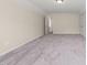 A bedroom with plush carpeting, neutral walls and good lighting at 7652 Channery Way, Raleigh, NC 27616