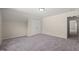 A spacious bedroom featuring plush carpeting, neutral walls, and closet at 7652 Channery Way, Raleigh, NC 27616