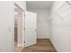 Walk-in closet featuring ample shelving and tile flooring at 7652 Channery Way, Raleigh, NC 27616