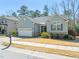 Charming single-Gathering home featuring manicured landscaping and a two-car garage at 7652 Channery Way, Raleigh, NC 27616