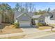 Charming single-Gathering home with a well-maintained yard, two-car garage and inviting entrance at 7652 Channery Way, Raleigh, NC 27616