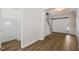 Inviting foyer featuring hardwood floors and staircase at 7652 Channery Way, Raleigh, NC 27616