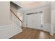 Bright foyer with hardwood floors, staircase, and a double door entrance at 7652 Channery Way, Raleigh, NC 27616