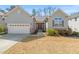 Charming single-Gathering home with a two-car garage and inviting front yard at 7652 Channery Way, Raleigh, NC 27616