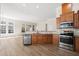 Spacious kitchen with stainless steel appliances and hardwood floors at 7652 Channery Way, Raleigh, NC 27616