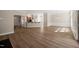 Bright living space with hardwood floors, kitchen with bar seating, and a dining area at 7652 Channery Way, Raleigh, NC 27616