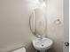 Cozy powder room featuring a pedestal sink and a mirror at 7652 Channery Way, Raleigh, NC 27616