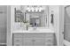 Bright vanity area with cabinets and a mirror reflecting a view of the bedroom at 7706 Falcon Rest Cir, Raleigh, NC 27615
