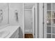 Bright bathroom featuring a vanity, framed mirror, and a glass door shower at 7706 Falcon Rest Cir, Raleigh, NC 27615