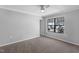Bedroom with a neutral palate and large window offering a relaxing retreat at 7706 Falcon Rest Cir, Raleigh, NC 27615