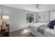 Comfortable bedroom with a ceiling fan, carpet, and natural light from a large window at 7706 Falcon Rest Cir, Raleigh, NC 27615