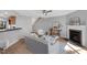 Inviting living room with a fireplace, open layout, and stylish decor, connecting seamlessly with other spaces at 7706 Falcon Rest Cir, Raleigh, NC 27615
