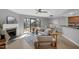 Bright living room featuring a fireplace, stylish decor, and sliding glass doors to the outside at 7706 Falcon Rest Cir, Raleigh, NC 27615