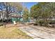 Community playground for Gathering fun amid trees and landscaping at 7706 Falcon Rest Cir, Raleigh, NC 27615