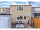 A clean backyard patio including storage, air conditioner and pleasant seating area at 7727 Ohmann Ct, Raleigh, NC 27615