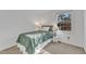 Bedroom featuring neutral walls, carpet, a large window, and comfortable furniture at 7727 Ohmann Ct, Raleigh, NC 27615