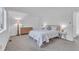 Bright bedroom includes a cozy bed, a wooden dresser, and ample natural light from the window at 7727 Ohmann Ct, Raleigh, NC 27615