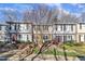 Charming townhome exteriors showcasing well-kept lawns, stone steps, and inviting entryways at 7727 Ohmann Ct, Raleigh, NC 27615