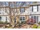 Well-maintained townhome exteriors feature manicured landscaping, beautiful trees, and inviting entrances at 7727 Ohmann Ct, Raleigh, NC 27615