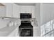 Well-equipped kitchen with stainless steel appliances and white cabinetry for a clean, modern look at 7727 Ohmann Ct, Raleigh, NC 27615