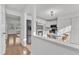 Open concept kitchen with modern stainless steel appliances and a breakfast nook adjacent to the living space at 7727 Ohmann Ct, Raleigh, NC 27615