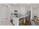 Well-equipped kitchen with stainless steel appliances, granite countertops, and a breakfast bar at 808 Kenyon Spring Dr, Zebulon, NC 27597