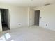 Unfinished bedroom with open doorways and neutral color scheme at 837 Kenyon Spring Dr, Zebulon, NC 27597
