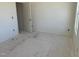 Unfinished bedroom with access to additional rooms, neutral walls and trim at 837 Kenyon Spring Dr, Zebulon, NC 27597