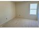 Unfinished bedroom with natural light, neutral walls, and unfinished flooring at 837 Kenyon Spring Dr, Zebulon, NC 27597