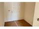 Entryway featuring a paneled white door, light beige walls, and bare floors at 837 Kenyon Spring Dr, Zebulon, NC 27597