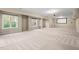 Large, carpeted basement has lots of natural light, recessed lighting, and a projector screen at 9 Water Stone Ct, Durham, NC 27705