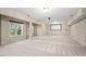 Large basement features several windows, projector screen and recessed lighting at 9 Water Stone Ct, Durham, NC 27705